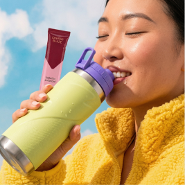 Person holding hydration stick